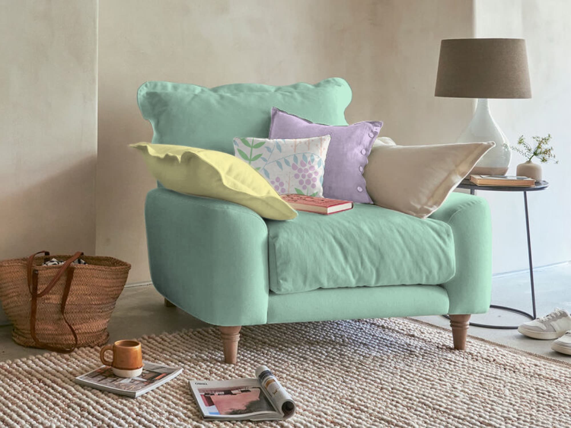 Mint-green spring-palette armchair with patterned cushions