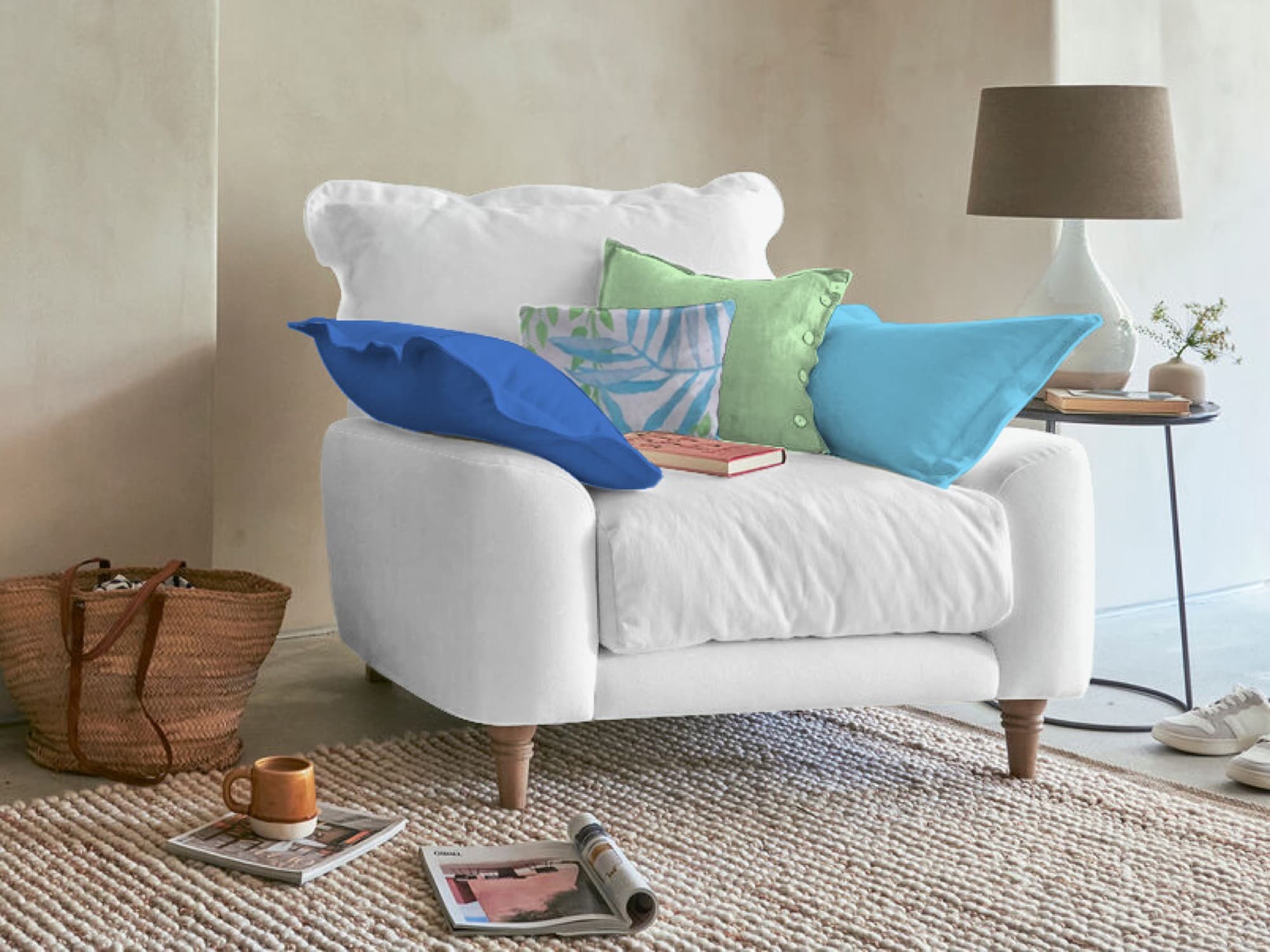 Cream autumn-palette armchair with ochre and olive cushions