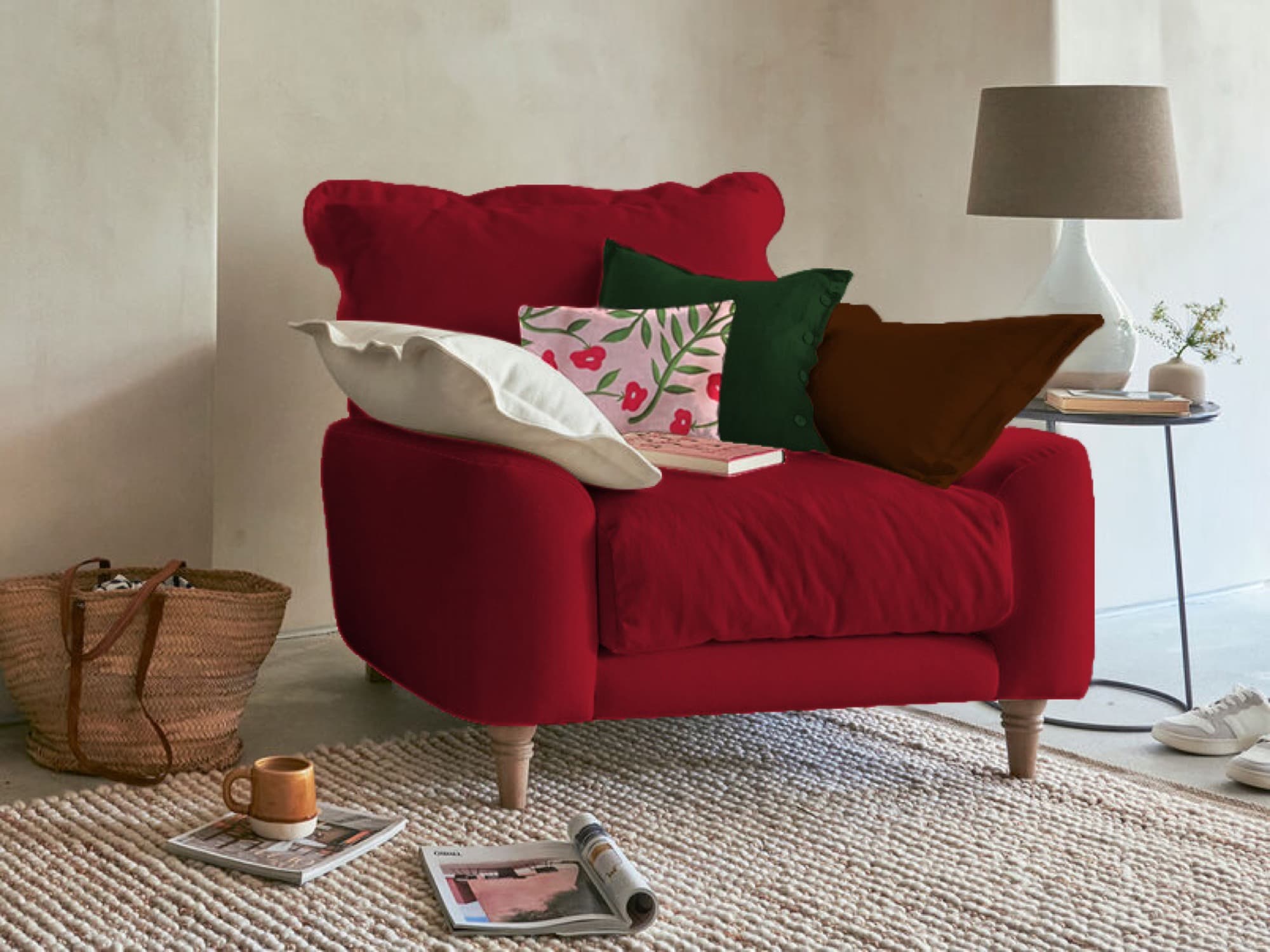 Deep red winter-palette armchair with patterned cushions