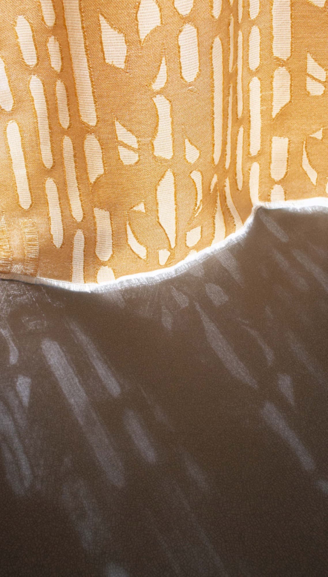 Sheer purple-toned printed textile detail