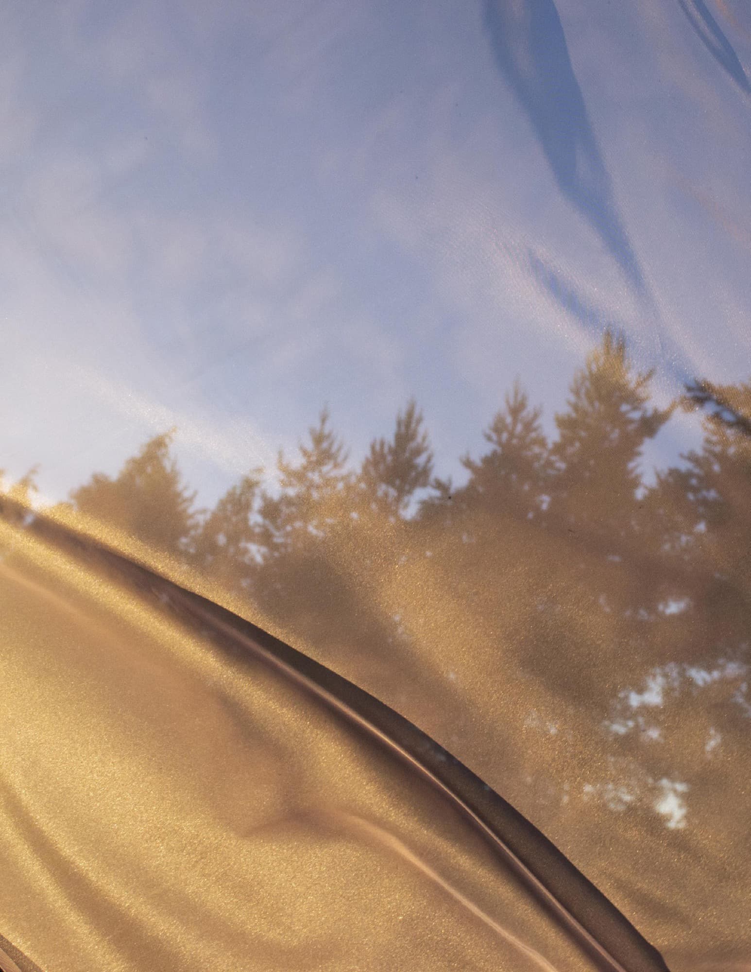 Model in a golden dye-patterned dress, Golden Harmony sub-collection